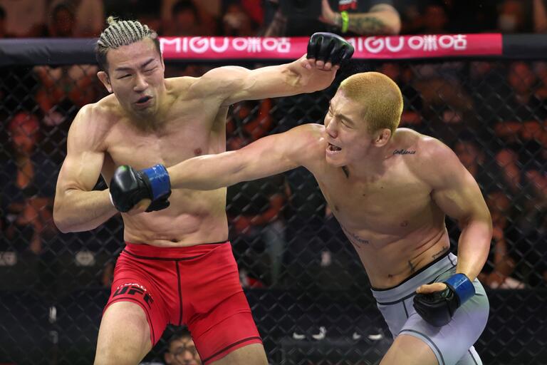  (R-L) SangWon Kim of South Korea knocks out Keisuke Sasu of Japan in a featherweight fight during the Road to UFC event at the UFC Performance Institute on May 27, 2023 in Shanghai, China. (Photo by Zhang Lintao/Zuffa LLC)