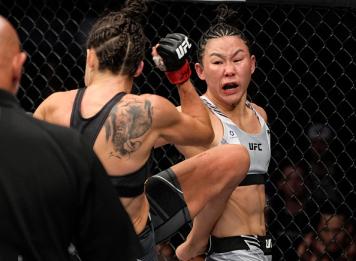 Yan Xiaonan of China lands a spinning back fist against Marina Rodriguez of Brazil in their strawweight fight during the UFC 272 event on March 05, 2022 in Las Vegas, Nevada. (Photo by Jeff Bottari/Zuffa LLC)
